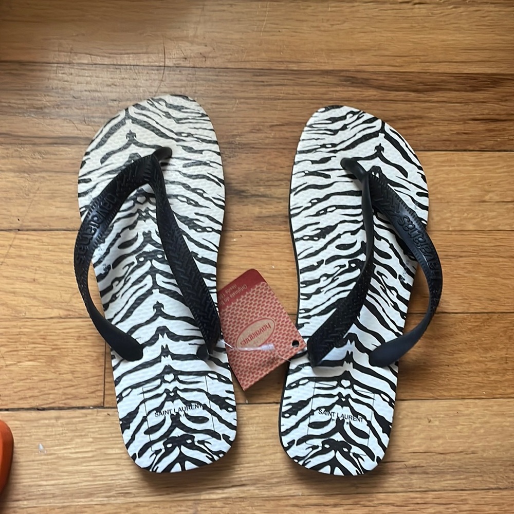 Brand new with tags Havaianas flip flops with zebra print. Sized 6.